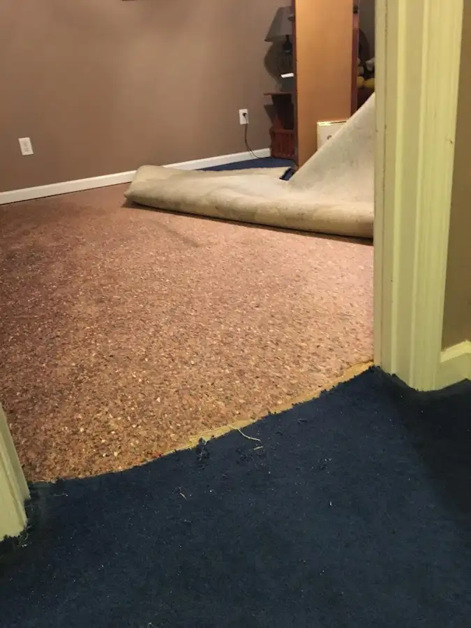 Carpet pad removal revealing water damage during Water Mitigation Services in Horizon City